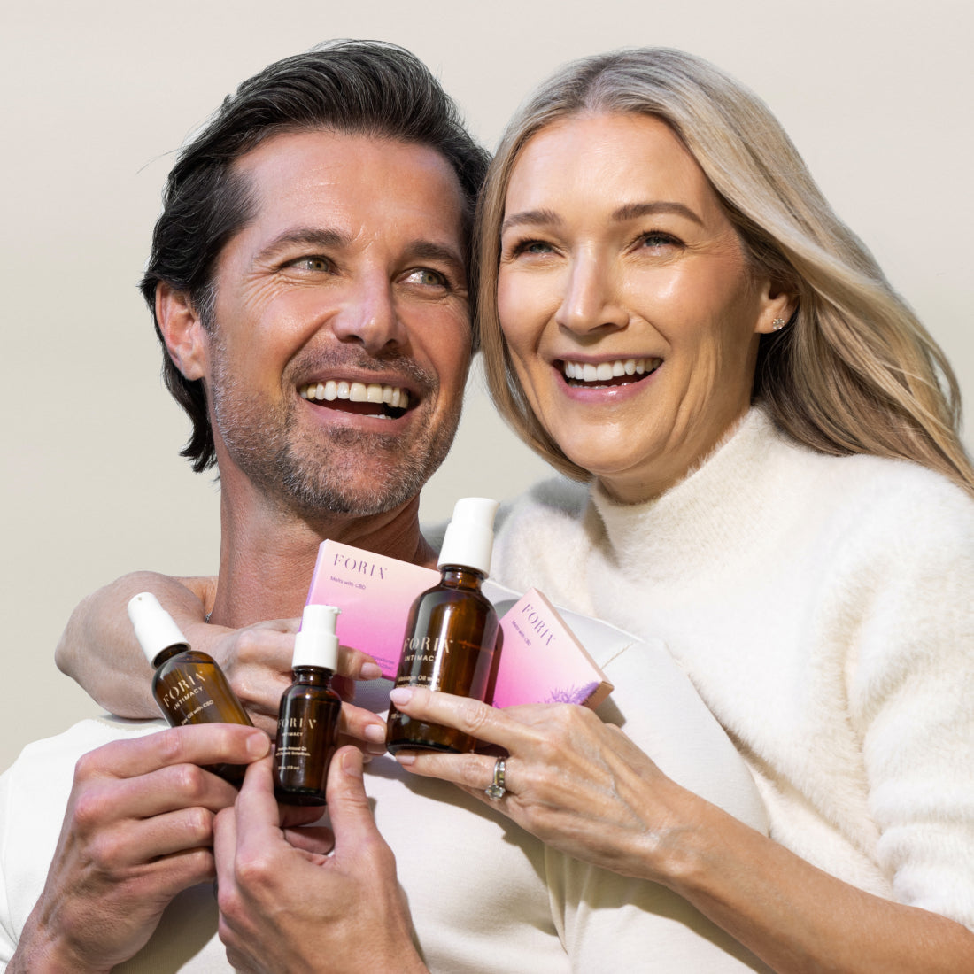 Foria Honeymoon Set with intimate massage oils and sensual accessories, displayed on a cozy, inviting lifestyle setting.