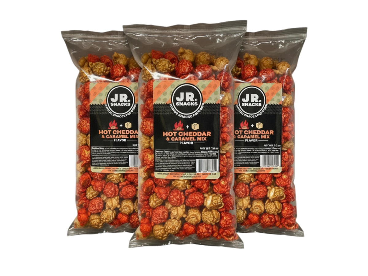 Junior Snacks Company Hot Cheddar and Caramel Mix in a three-pack, featuring colorful snack bags with cheesy and sweet treats.