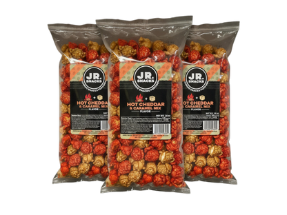 Junior Snacks Company Hot Cheddar and Caramel Mix in a three-pack, featuring colorful snack bags with cheesy and sweet treats.