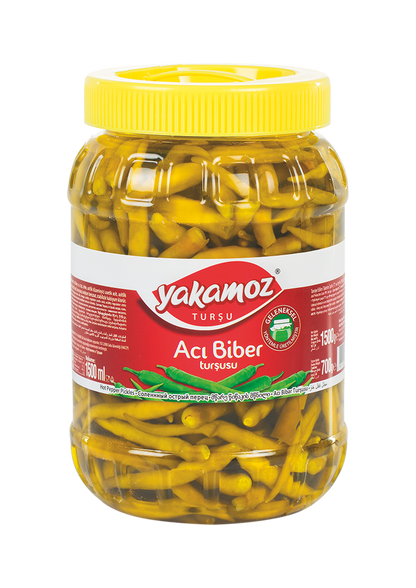 S101 Yakamoz hot pepper pickle in a clear glass jar, showcasing vibrant red hot peppers and pickle slices inside.