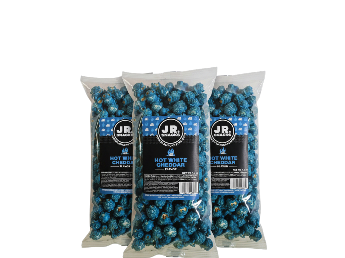 Junior Snacks Co. Hot White Cheddar snacks in a 3-pack, featuring cheesy flavor and crispy texture, perfect for kids.