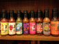 Cinderosa Ranch Bruce's Pick All 8 Hot Sauces combo set with various colorful bottles on a wooden table.
