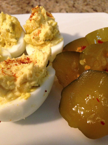 Cinderosa Ranch Passion Pickles® Ghost Pepper Homestyle Chips in a glass jar with crispy pickle chips visible.
