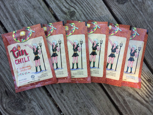 Six packets of Cinderosa Ranch Cin Chili Seasoning Mix, with colorful spice blend packaging displayed.