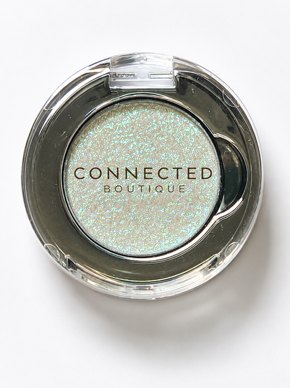 Connected Boutique Galactic Shift duochrome eyeshadow with color-shifting pressed pigment in vibrant, iridescent shades.