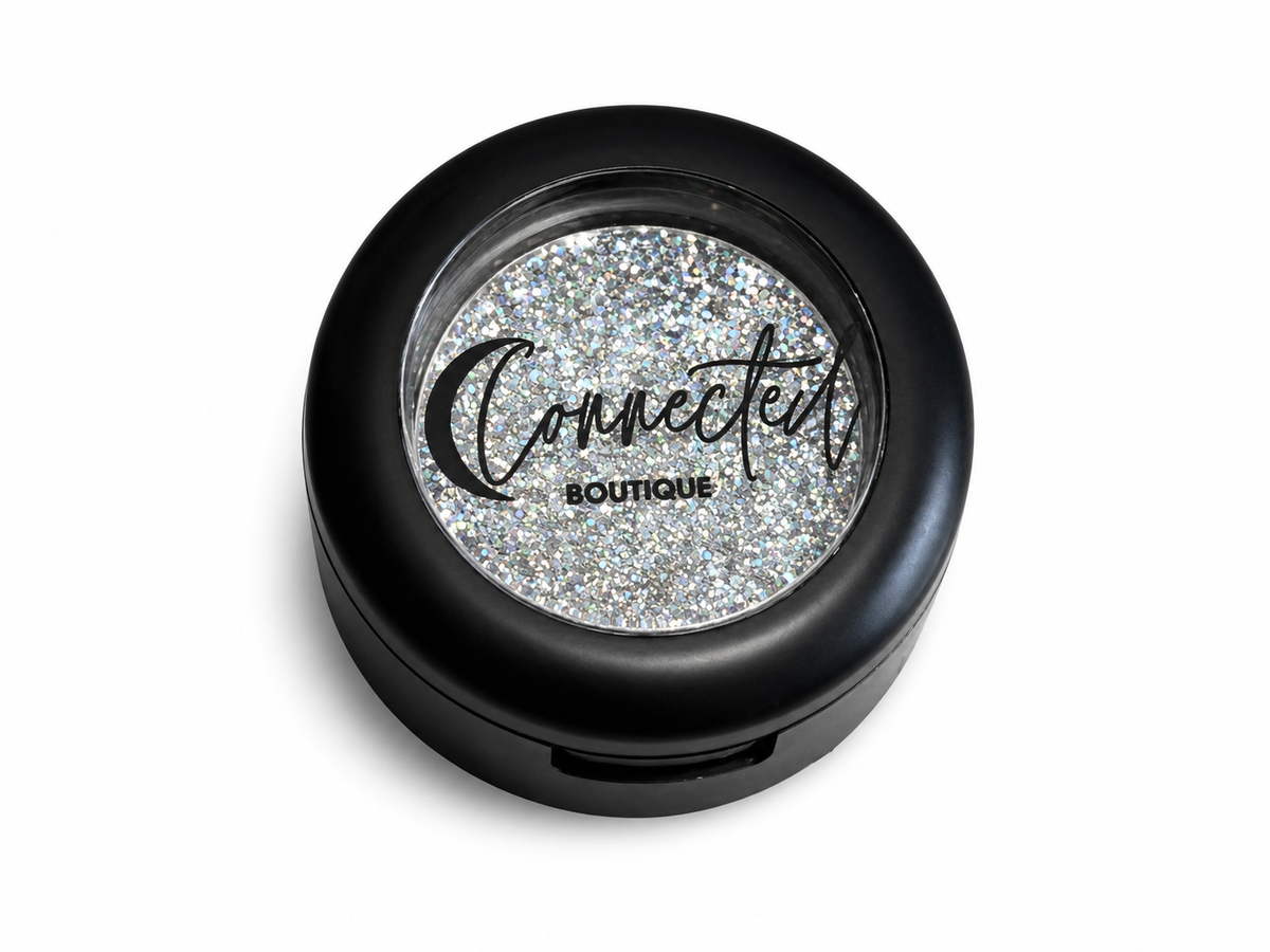 Connected Boutique Grand Central Glam duo-chrome glitter eyeshadow single with shimmering, multi-color finish and sleek packaging.