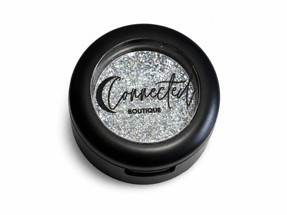 Connected Boutique Grand Central Glam duo-chrome glitter eyeshadow single with shimmering, multi-color finish and sleek packaging.