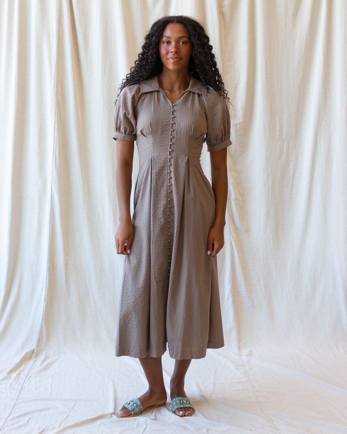 Downeast Femme Field Dress, casual women's dress with floral pattern and short sleeves, displayed on a hanger.