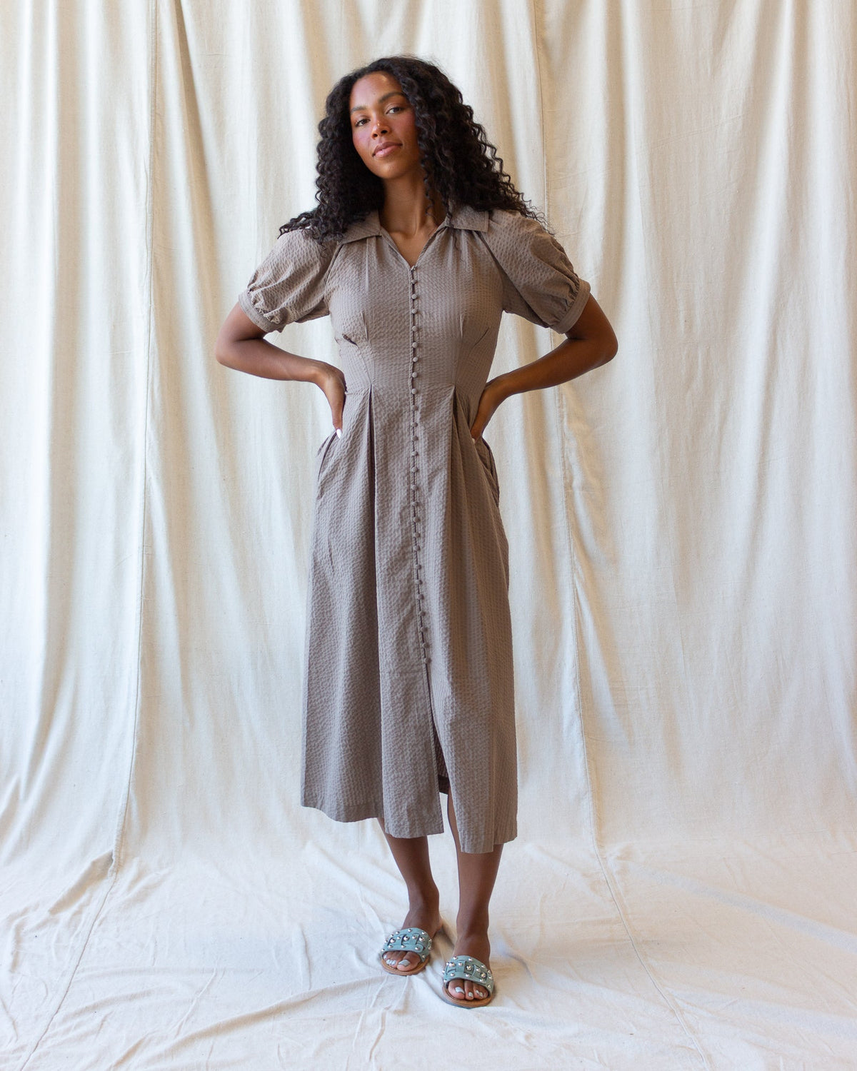 Downeast Femme Field Dress displayed on a hanger with floral pattern and lightweight fabric, suitable for casual or outdoor wear.