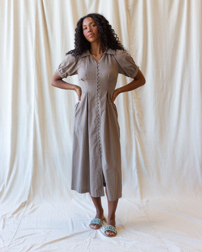 Downeast Femme Field Dress displayed on a hanger with floral pattern and lightweight fabric, suitable for casual or outdoor wear.