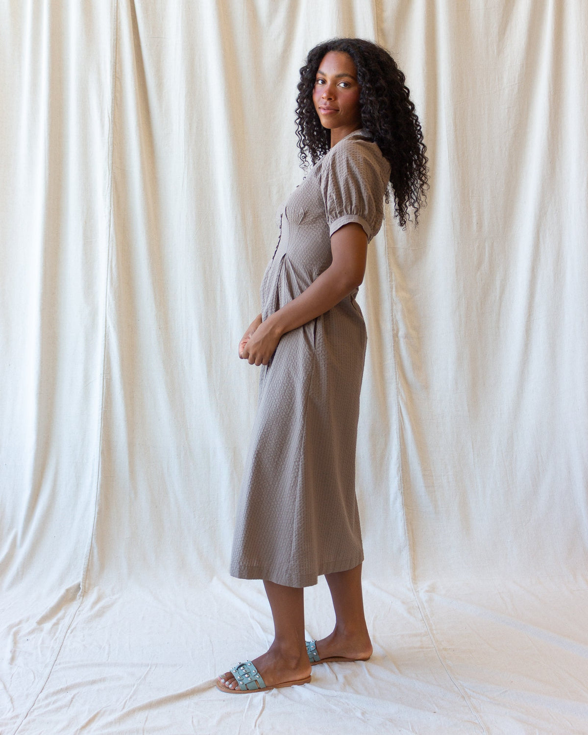 Downeast Femme Field Dress displayed on a hanger, featuring a casual, flowy design with a floral pattern and short sleeves.
