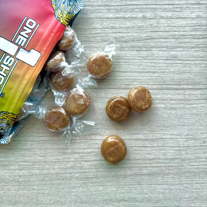 Bundle of 1 Shot Energy Voice Stack products, featuring multiple energy supplement bottles with vibrant labels and branding.