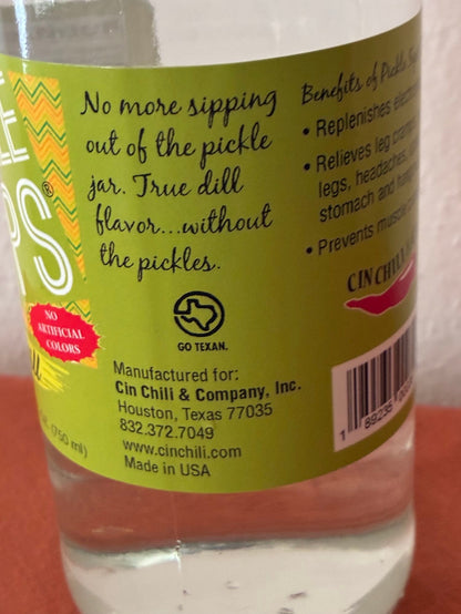Cinderosa Ranch Pickle Sips Dill flavor in 25.4 fl oz bottle with fresh dill and pickle slices visible.