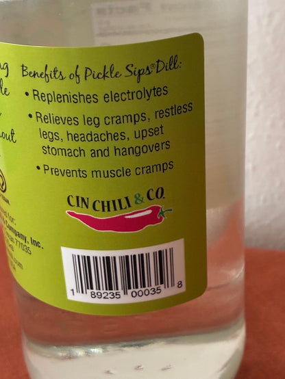 Cinderosa Ranch Pickle Sips Dill flavor in 25.4 fl oz bottle, featuring fresh dill pickling liquid with cucumbers and herbs.