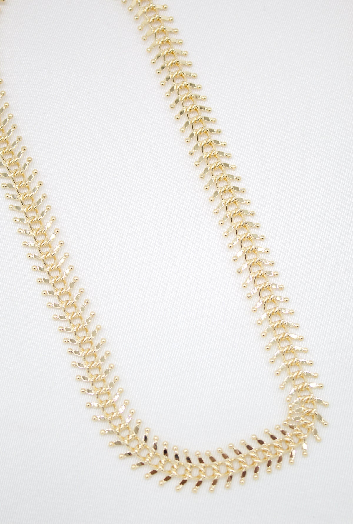 MIA Jewelry Designed Ball Spine Choker featuring a sleek, modern black choker with spherical accents on a model's neck.