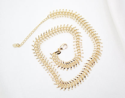 MIA Jewelry Designed Ball Spine Choker showing a black leather band with metallic ball accents on a model's neck.