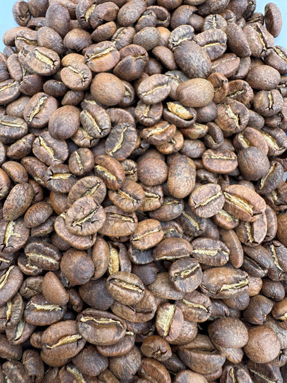 Blue cotton candy flavored roasted coffee from Good Brothers Coffee LLC, featuring a vibrant blue coffee bean and roasted surface.