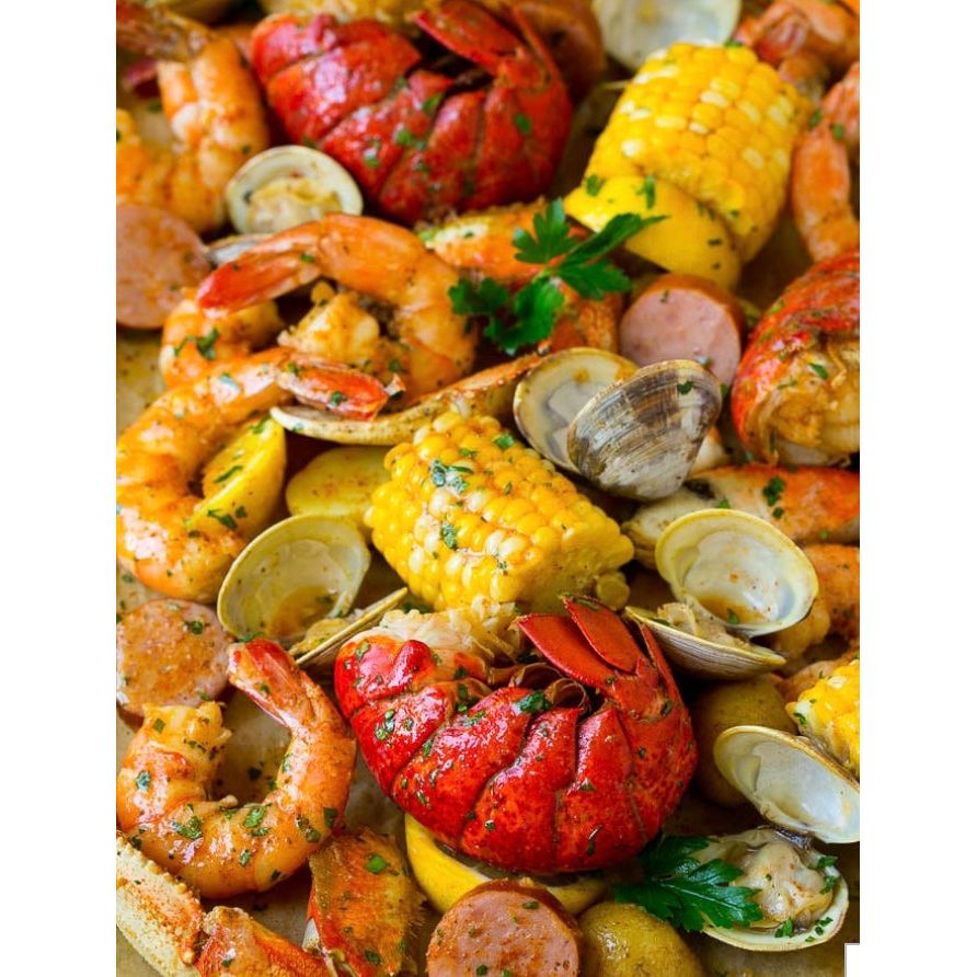 Spicy Mama seafood sauce in a jar, showcasing vibrant reddish-orange spice blend, perfect for seafood dishes and seasoning.