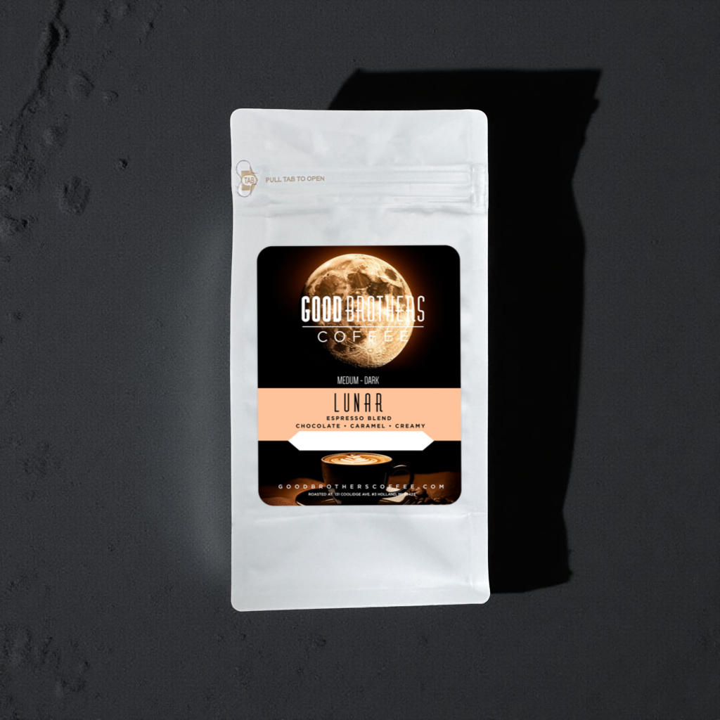 Freshly brewed Lunar Espresso Blend roasted coffee from Good Brothers Coffee LLC, showcasing rich, dark espresso beans in a cup.
