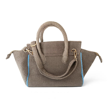 Beach Haus Cabana Tote Mini in Tobacco, showing the small woven tote bag with leather accents and sturdy handles.