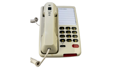 Cream MedPat Solutions D520U landline console phone with USB-A and USB-C charging ports on a table.