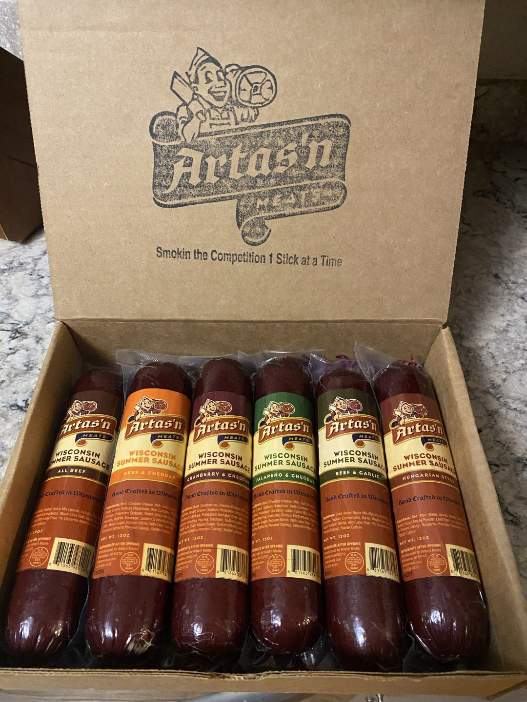 Artas'n Meats The Craft Six Collection gift box with six assorted sausages arranged in a decorative box.