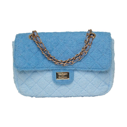 Small Shoreline Flap in two-tone blue by BEACH HAUS, featuring stylish design and fabric details.