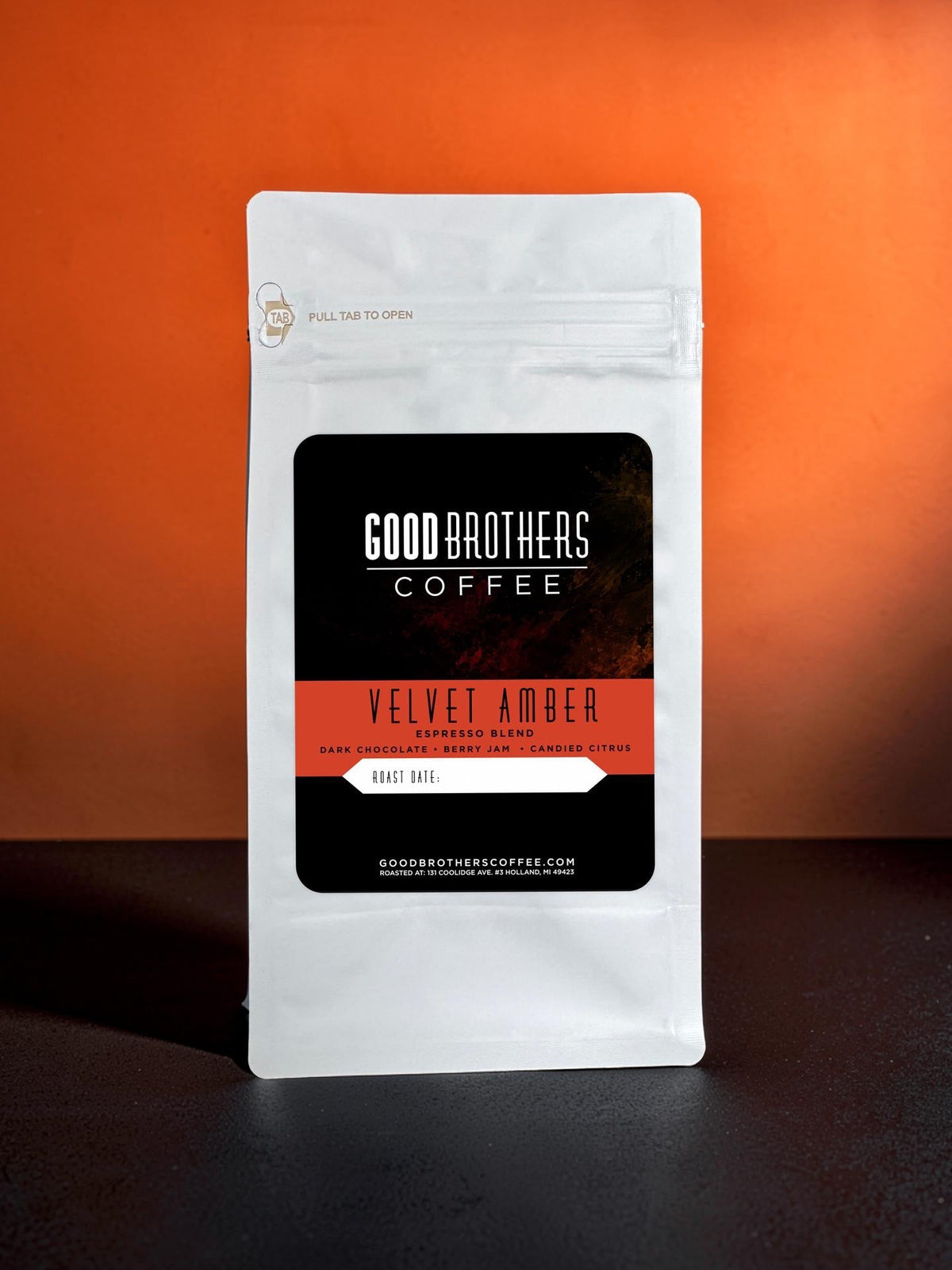 Velvet Amber Espresso Blend roasted coffee beans from Good Brothers Coffee LLC in a burlap sack with a rustic background.
