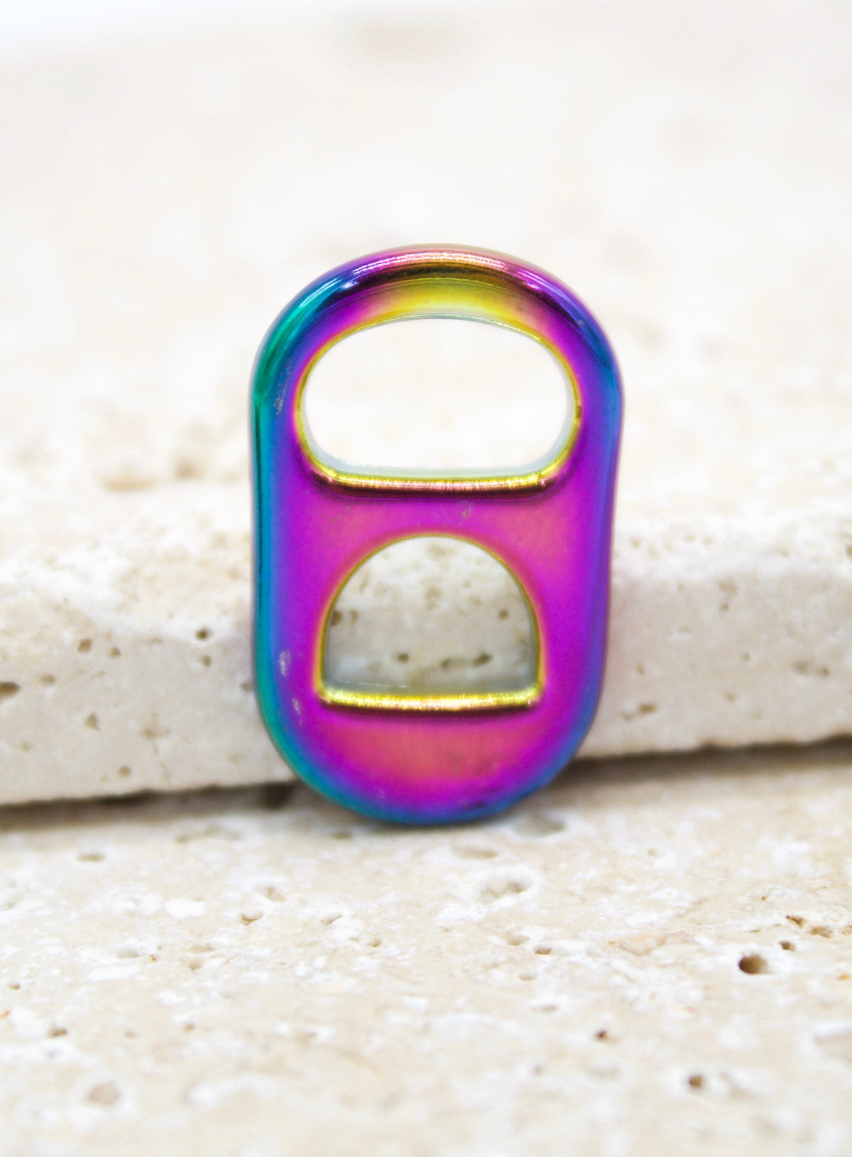 Holographic iridescent soda pull tab pendant in 18K gold filled from MIA Jewelry, showcasing its shiny, colorful surface.