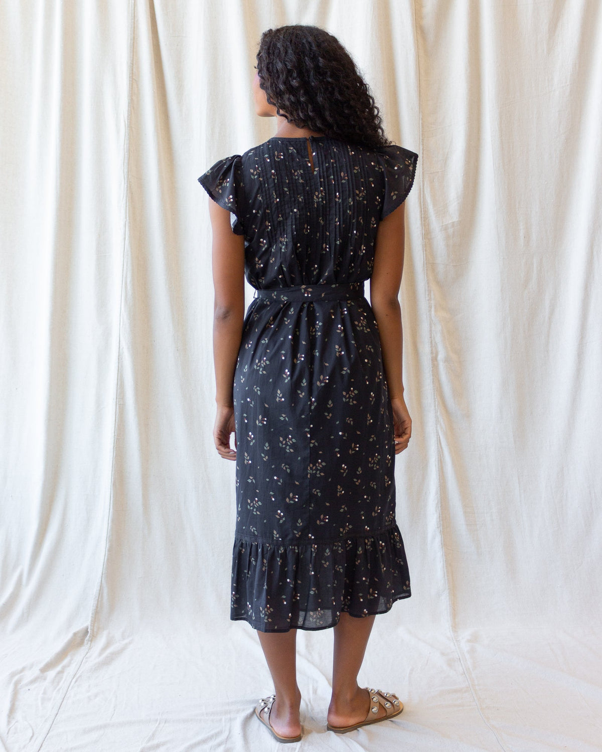 Downeast Pretty Pintuck Dress shown on a hanger with detailed pintuck design and soft fabric, perfect for casual or semi-formal wear.