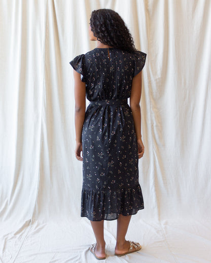 Downeast Pretty Pintuck Dress shown on a hanger with detailed pintuck design and soft fabric, perfect for casual or semi-formal wear.
