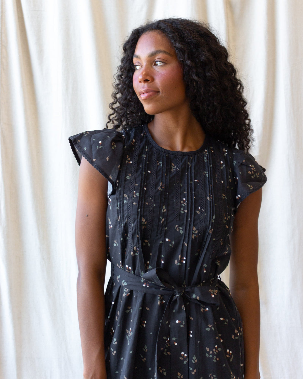 Downeast Pretty Pintuck Dress featuring a soft fabric, pintuck details, and a flattering silhouette ideal for casual or semi-formal wear.