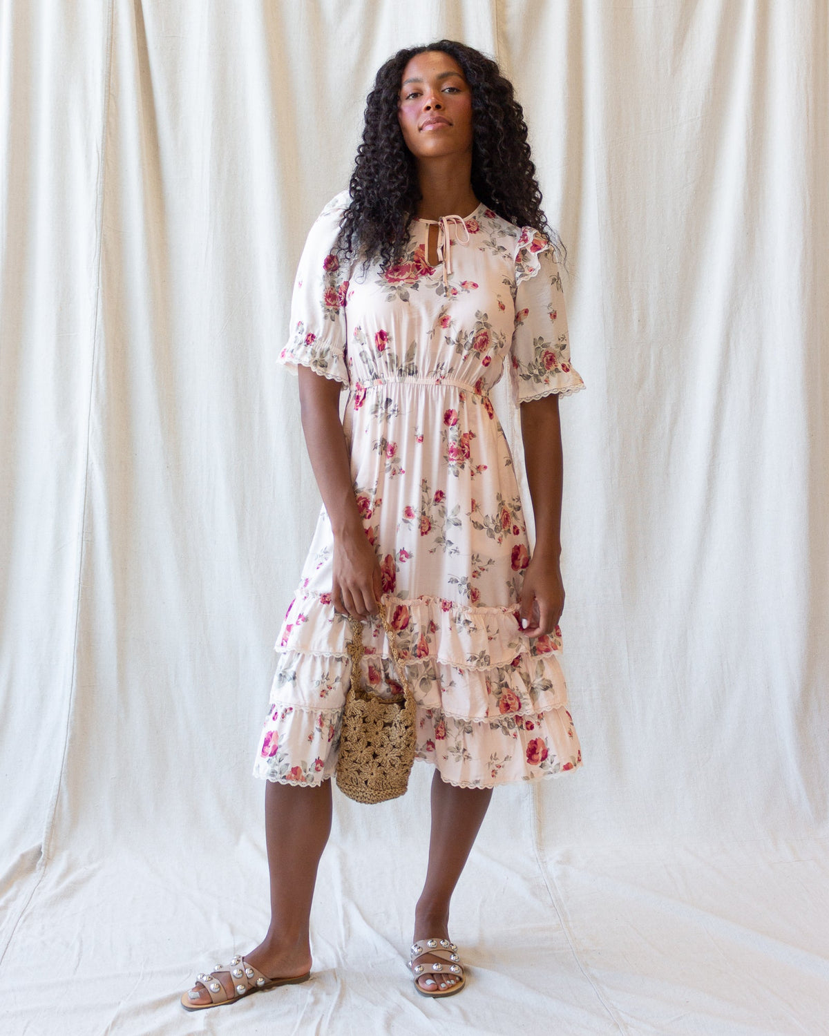 Vintage Romance dress by Downeast featuring floral print, sleeveless design, and flowing fabric ideal for elegant occasions.