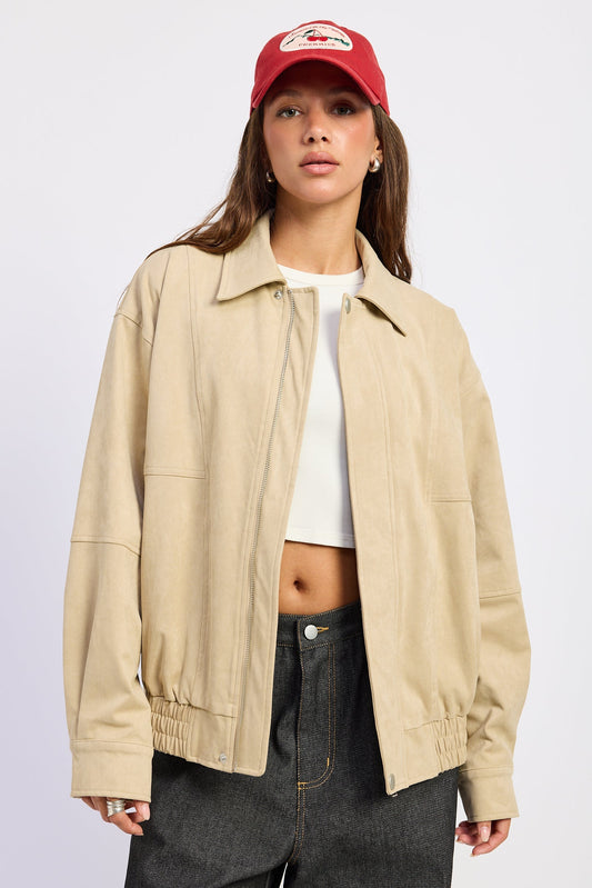 Emory Park Journey suede bomber jacket in light beige, showing a fitted style with ribbed collar and cuffs.