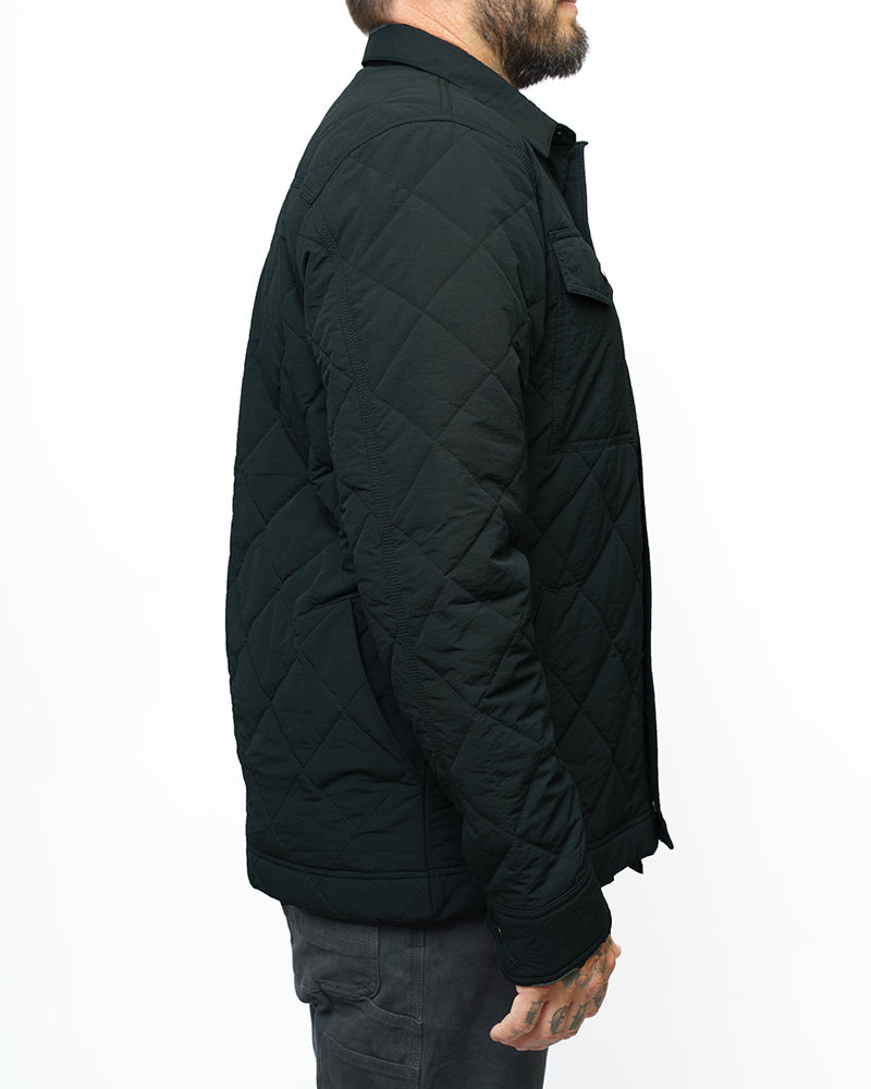 Off The Grid Surplus Ignite quilted jacket in vintage black, showing a close-up of the stylish, insulated jacket fabric and design.