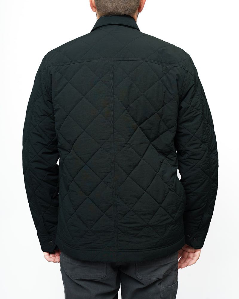 Off The Grid Surplus Ignite quilted jacket in vintage black, showcasing its stylish quilted design and classic jacket silhouette.