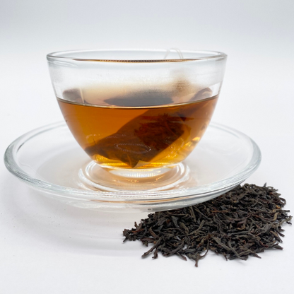 Loose leaf Irish Breakfast black tea by Novel Tea Book Shop in a clear, resealable package with tea leaves visible inside.