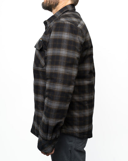 Black Ironside Flannel jacket by Off The Grid Surplus with a relaxed fit, shown hanging on a wooden hanger.
