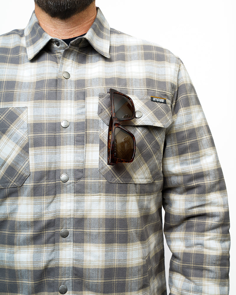 Off The Grid Surplus Ironside Flannel Castlerock jacket with button closure and plaid pattern, displayed on a hanger.