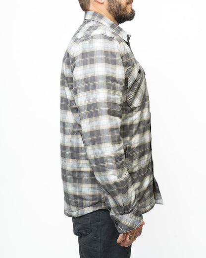 Off The Grid Surplus Ironside Flannel Castlerock jacket, shown in rugged plaid fabric with button closure and chest pockets.