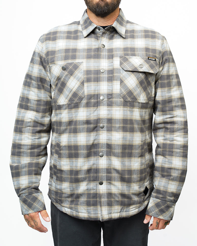 Off The Grid Surplus Ironside Flannel Castlerock jacket with a button-up front and rugged plaid design.