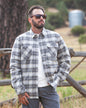 Off The Grid Surplus Ironside Flannel Castlerock jacket, rugged outdoor-style with plaid pattern and button closure.