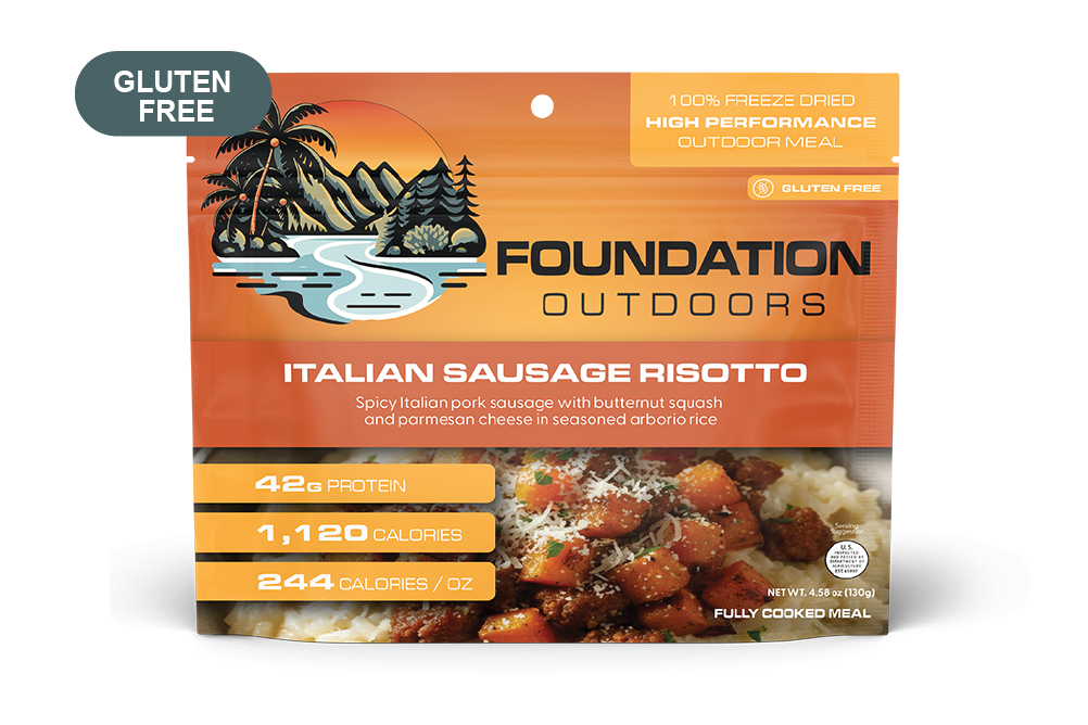 Creamy Spicy Italian Pork Sausage Risotto served on a plate, featuring chunks of sausage and garnished with herbs.