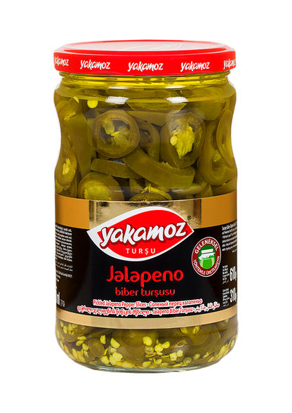 Glass jar of S101 Yakamoz Jalapeno Pickle with vibrant green jalapenos in brine, labeled as 610G.