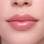 Shiny diamond lip gloss by KE Cosmetics featuring a clear tube with a sparkling, glossy finish for luscious lips.