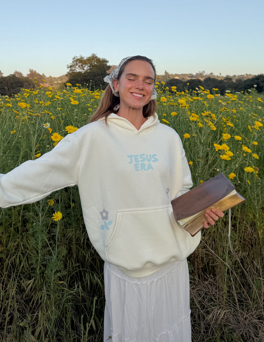 Unisex Jesus Era hoodie by Elevated Faith featuring religious imagery and comfortable fit, in natural fabric and casual style.