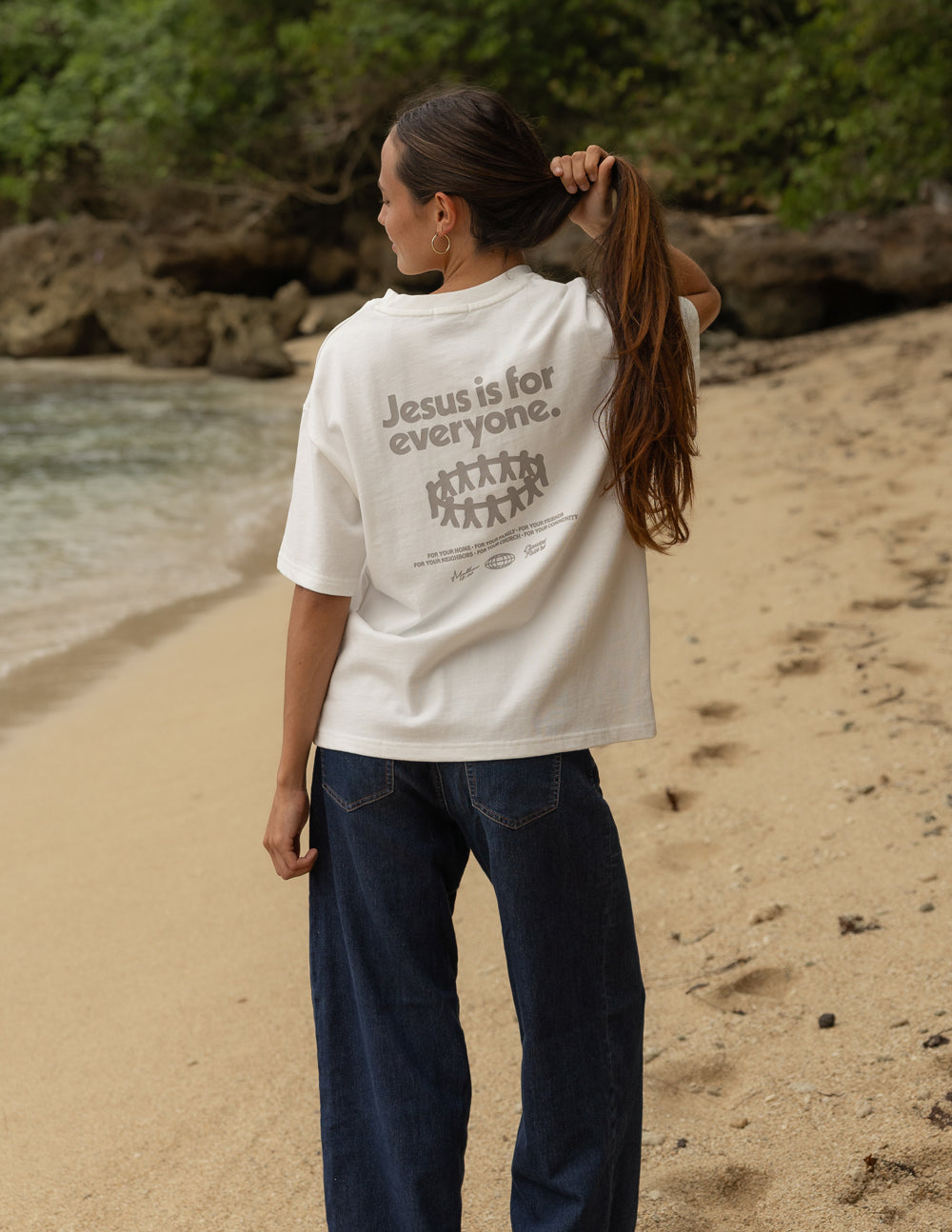 Black heavyweight T-shirt featuring a Jesus Is for Everyone design by Elevated Faith displayed on the front.