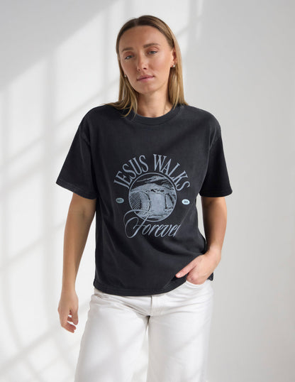 Black Jesus Walks heavyweight T-shirt by Elevated Faith featuring bold graphic design on the front.