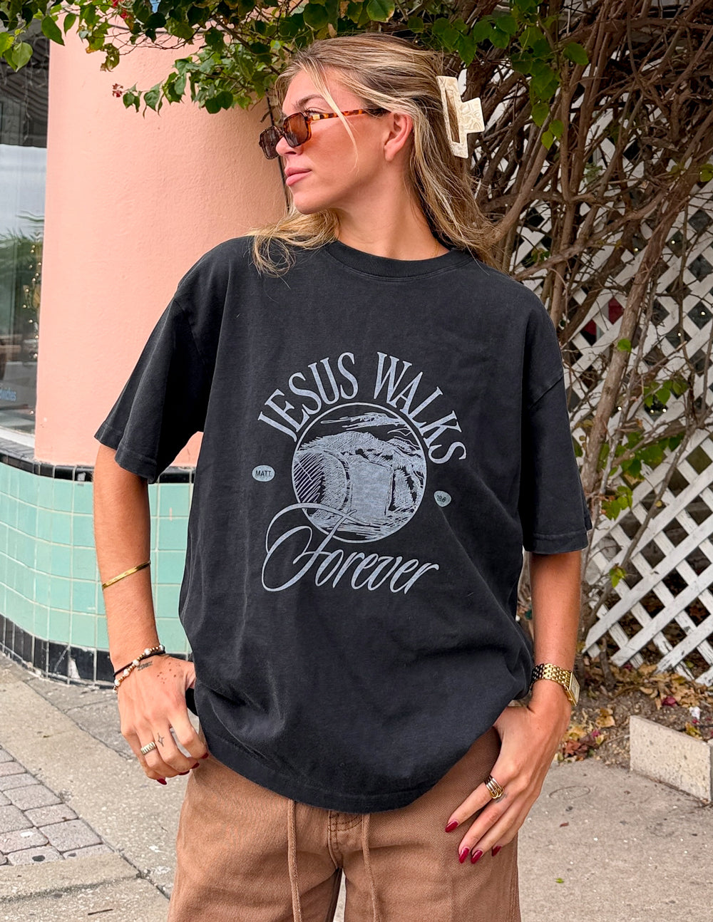 Black Jesus Walks heavyweight T-shirt by Elevated Faith featuring a bold graphic design on the front.