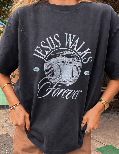 Black Jesus Walks Heavyweight T-Shirt by Elevated Faith featuring bold graphic print of Jesus walking on the front.